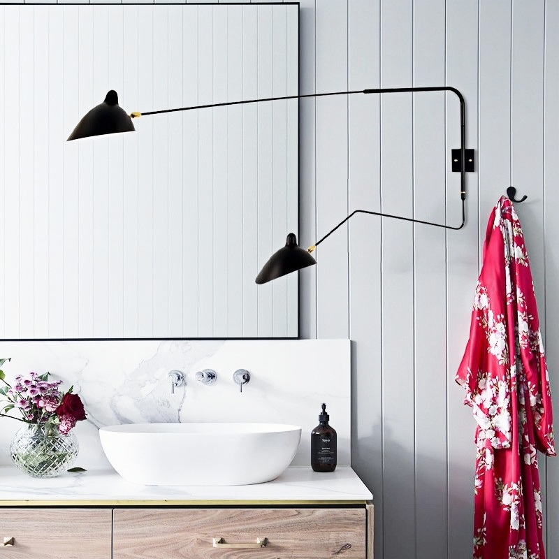 Black wall light in bathroom scene