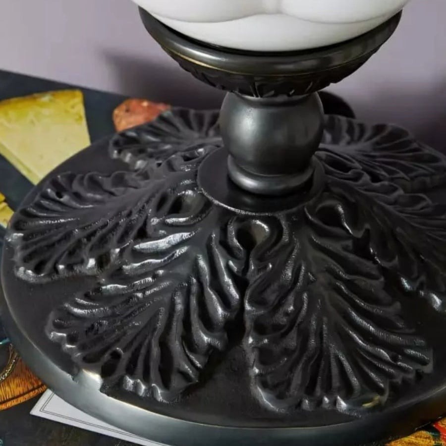 Delicate black iron base detail of the Eloise table lamp