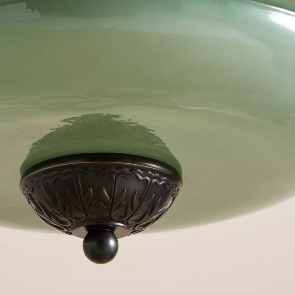 Vintage finial detail on green glass shade