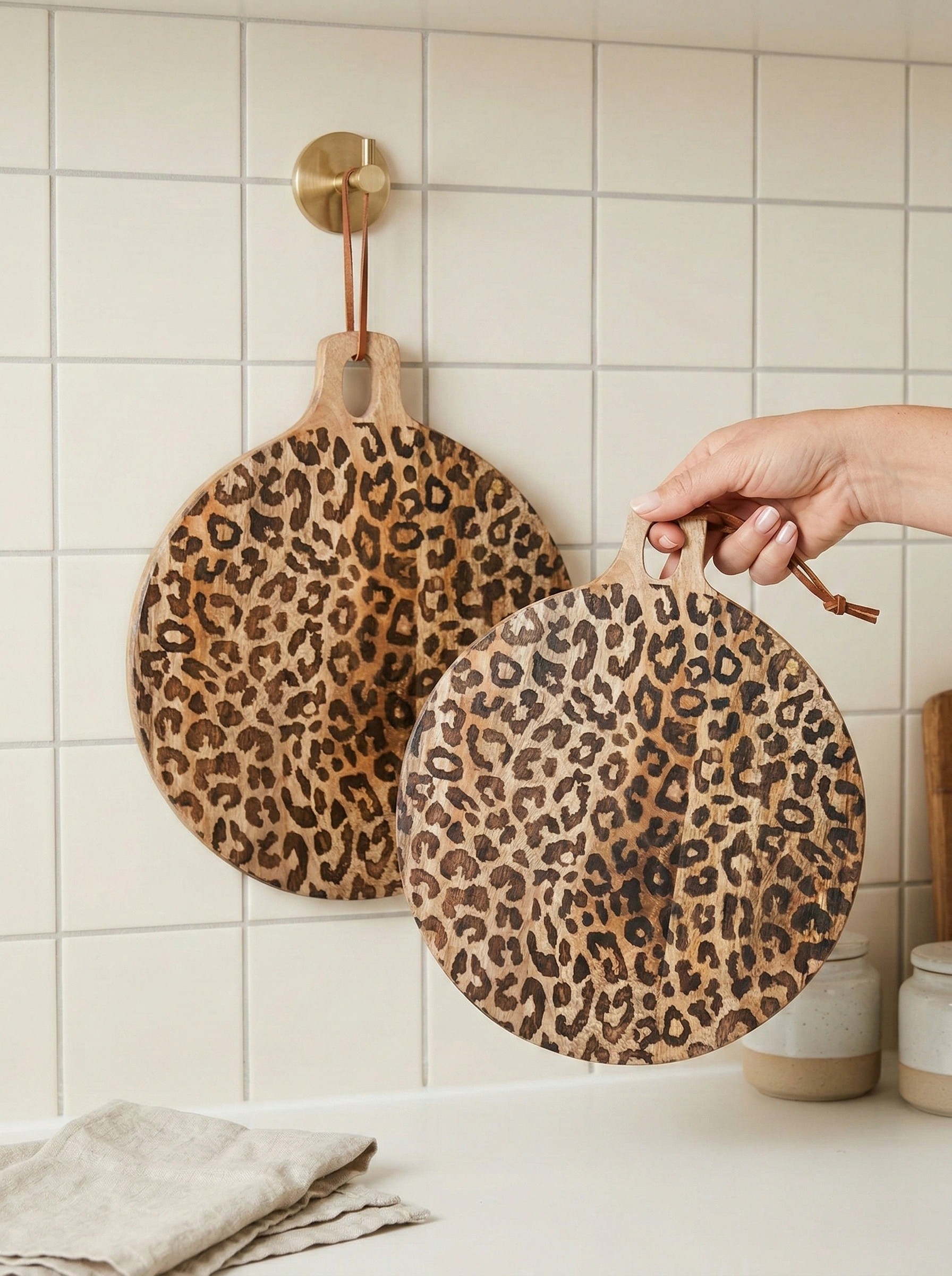 Leopard print boards hanging from their rope loops