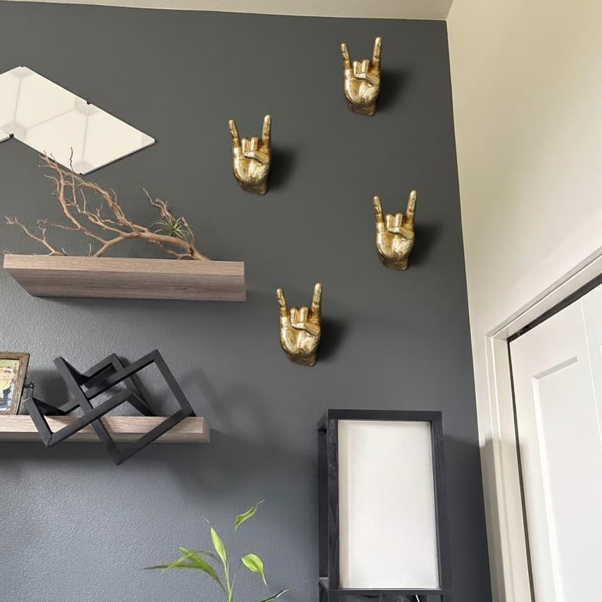 Customer photo of gold hand hooks on a wall