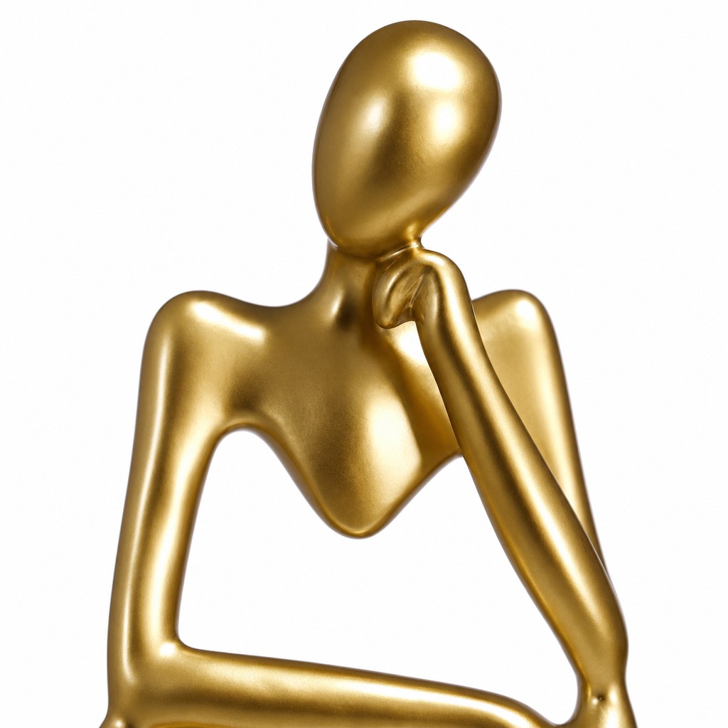 Gold minimalist human figurine close-up