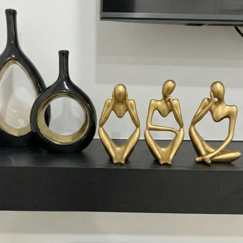 Customer review photo of gold figurines on shelf