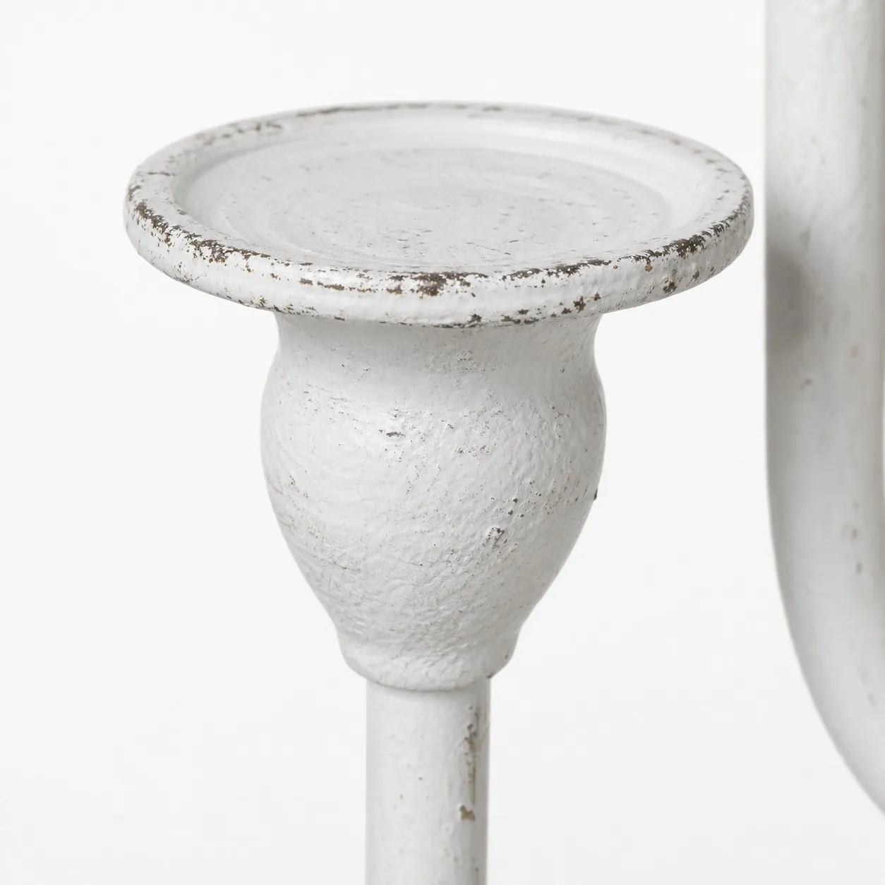 Close view of ivory branch candle cup and distressed finish