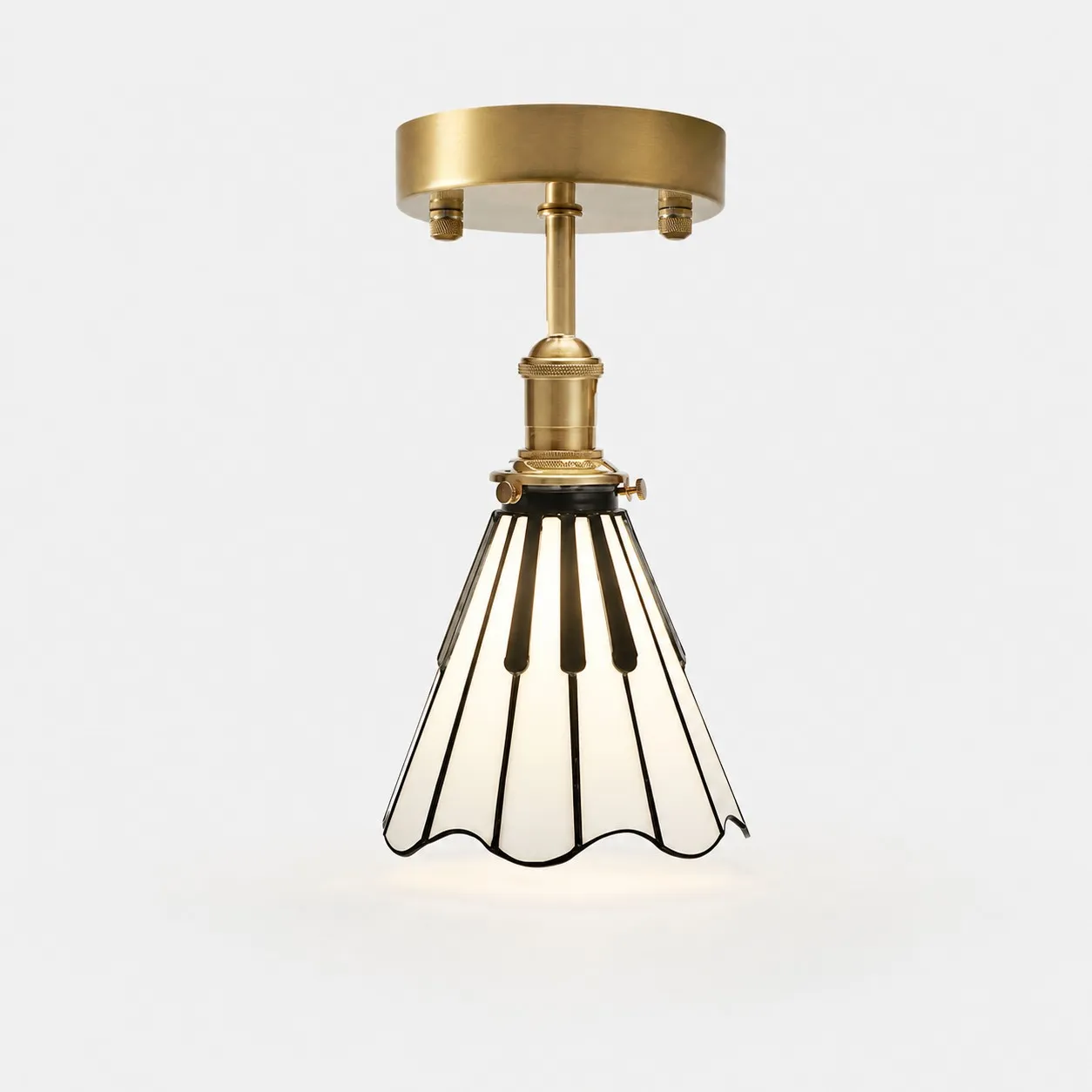 Piano key flush mount ceiling light in antique brass, black and opal glass